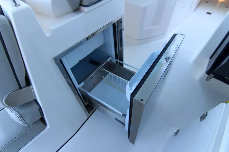 Endeavor Yacht Photos Pics Open storage compartment on 2023 Pursuit DC 295 Dual Console boat.