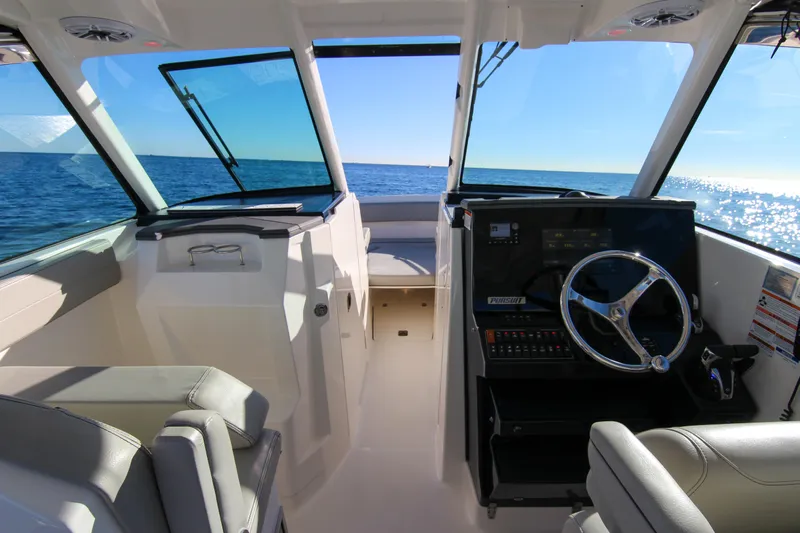 Endeavor Yacht Photos Pics 2023 Pursuit DC 295 Dual Console boat interior with ocean view.