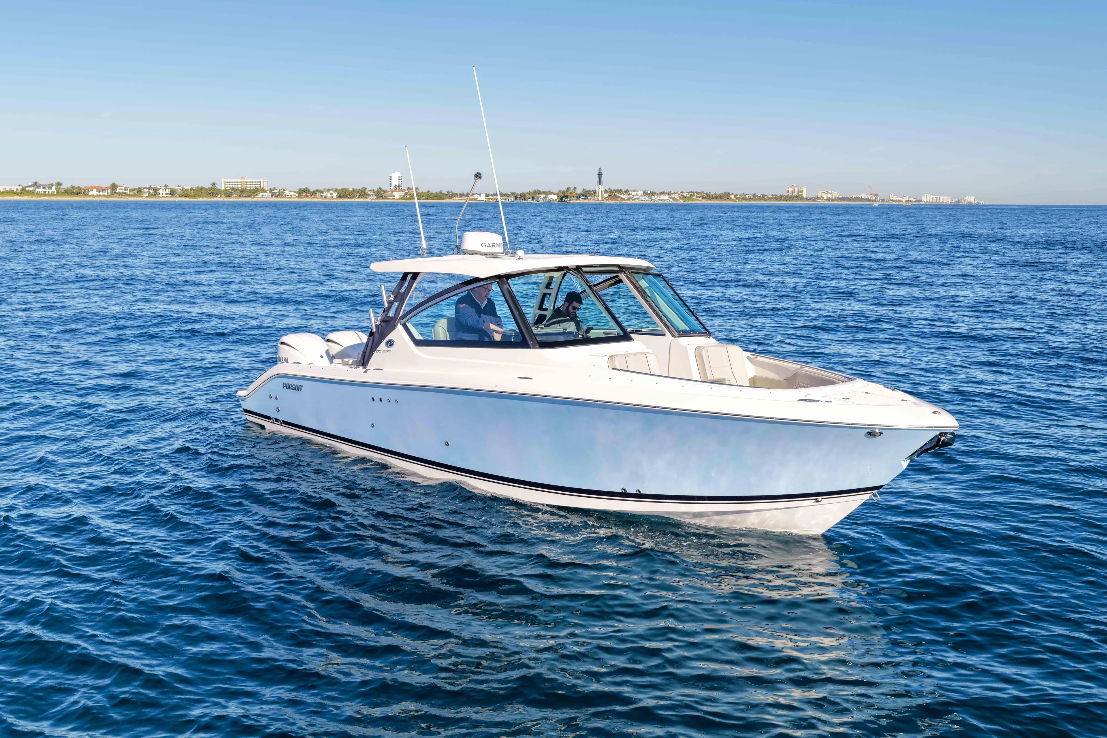 Endeavor Yacht Photos Pics 2023 Pursuit DC 295 Dual Console boat cruising on open water.