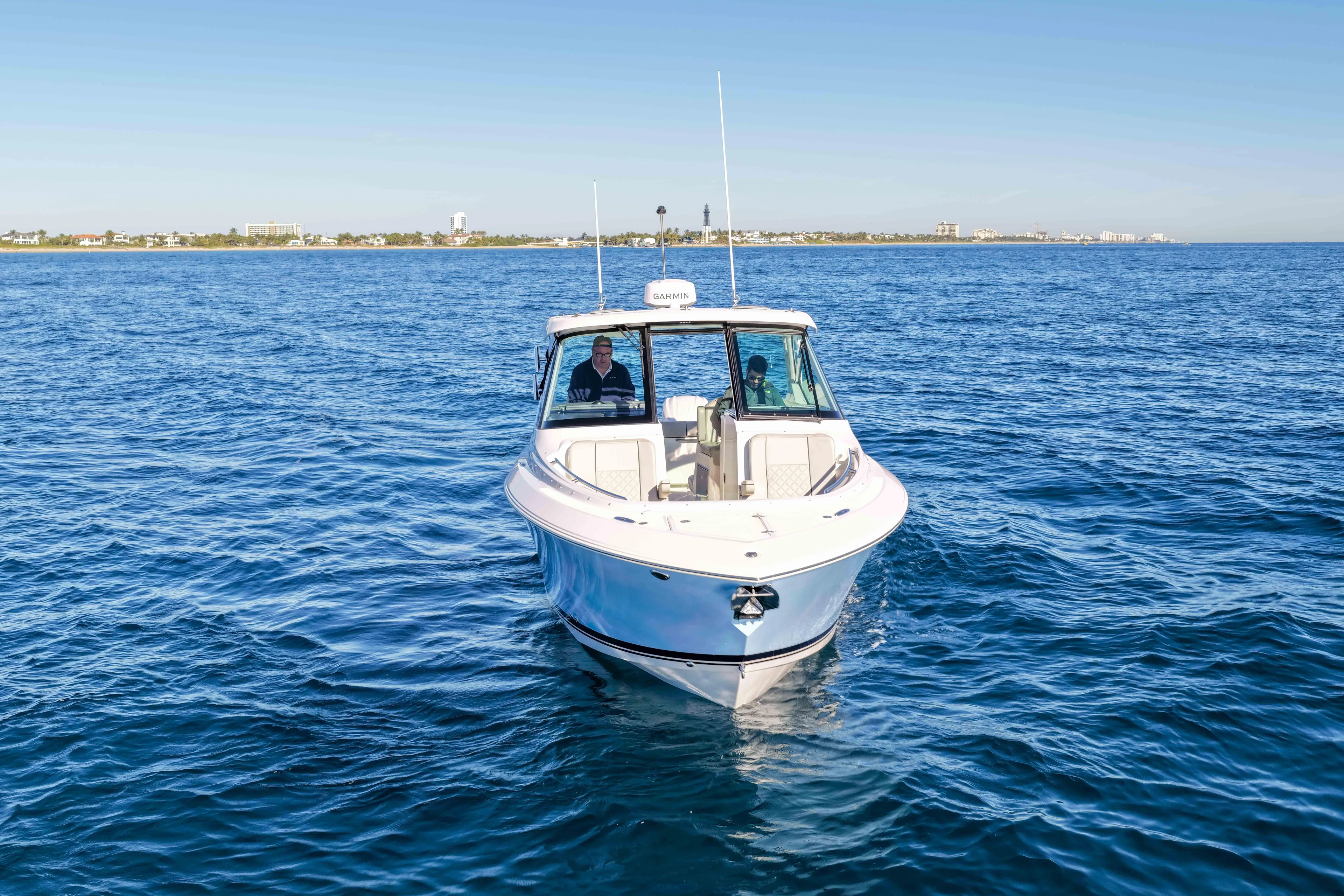 Endeavor Yacht Photos Pics 2023 Pursuit DC 295 Dual Console boat cruising on open water.