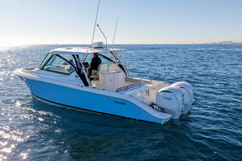 Endeavor Yacht Photos Pics 2023 Pursuit DC 295 Dual Console boat cruising on open water.