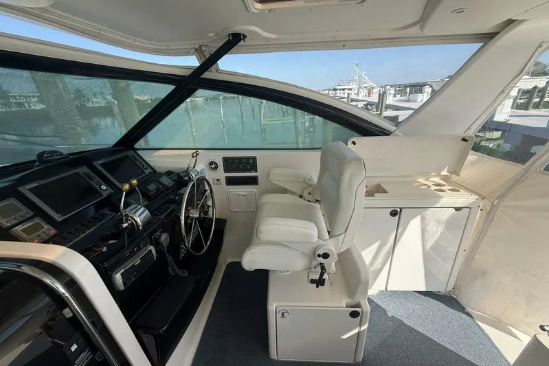 Grande Gator Yacht Photos Pics 2004 Tiara Yachts 4200 Open helm with modern controls and comfortable seating.