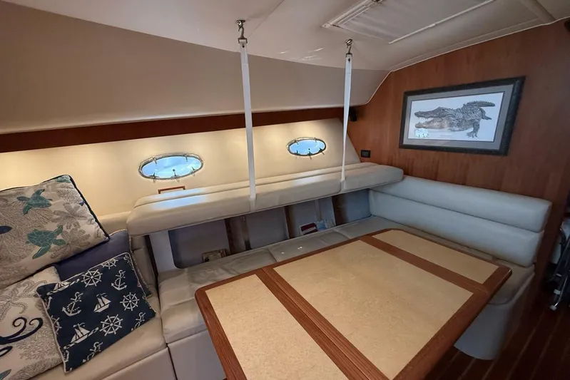Grande Gator Yacht Photos Pics Interior of 2004 Tiara Yachts 4200 Open with cozy seating and nautical decor.