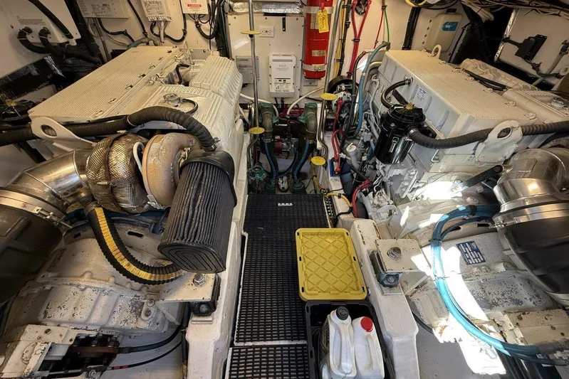 Grande Gator Yacht Photos Pics Engine room of a 2004 Tiara Yachts 4200 Open, featuring dual engines and equipment.