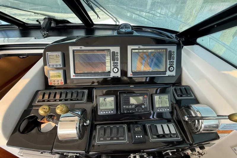 Grande Gator Yacht Photos Pics Dashboard of a 2004 Tiara Yachts 4200 Open with navigation and control systems.