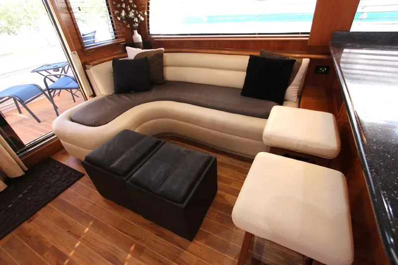 No Name Yacht Photos Pics Luxurious 2006 Navigator 5400 yacht interior with elegant seating and wooden flooring.