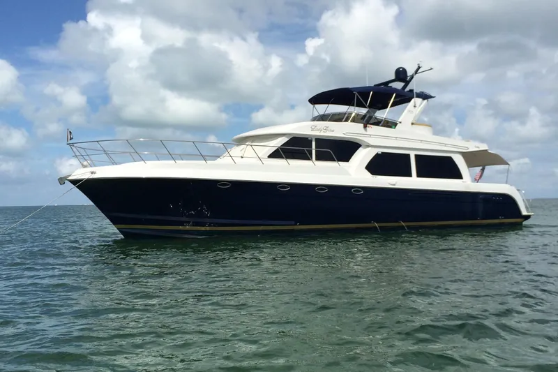 No Name Yacht Photos Pics 2006 Navigator 5400 yacht on calm sea under cloudy sky.