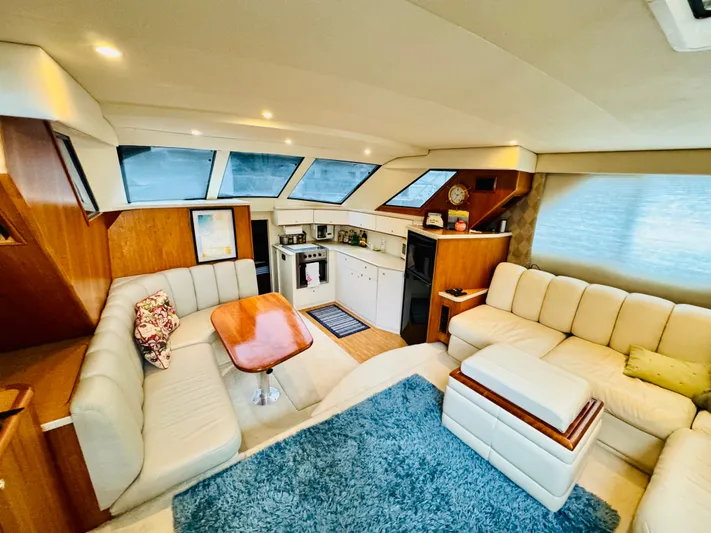 Precious Time Yacht Photos Pics Luxurious interior of 1998 Silverton 392 Motor Yacht with plush seating and modern amenities.