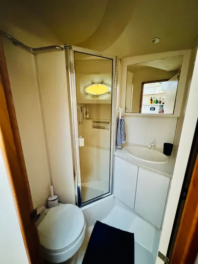 Precious Time Yacht Photos Pics Bathroom interior of 1998 Silverton 392 Motor Yacht with shower and sink.