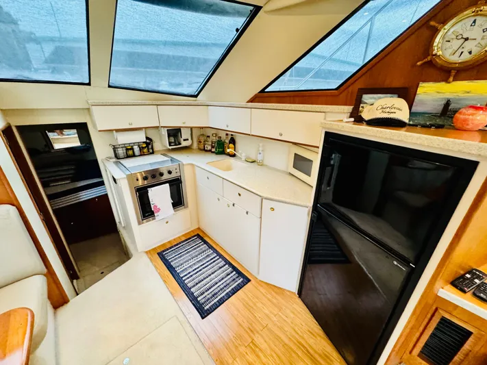 Precious Time Yacht Photos Pics Interior of 1998 Silverton 392 Motor Yacht with modern kitchen amenities and skylight.