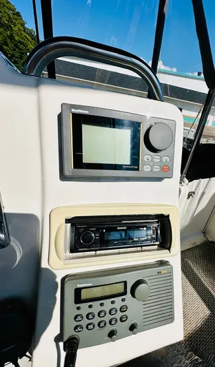 Precious Time Yacht Photos Pics Control panel of a 1998 Silverton 392 Motor Yacht with navigation and audio systems.