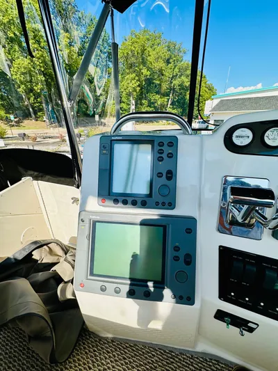 Precious Time Yacht Photos Pics 1998 Silverton 392 Motor Yacht helm with navigation screens and controls.