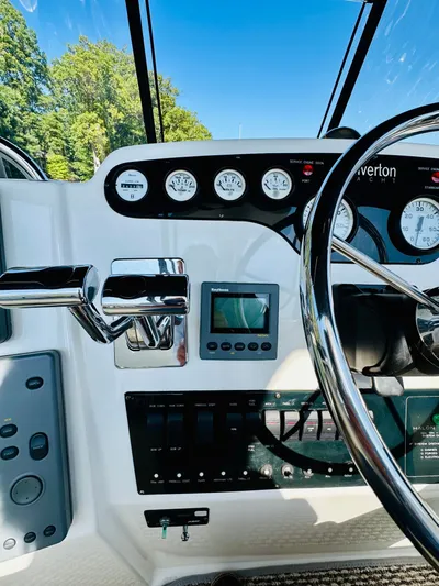 Precious Time Yacht Photos Pics 1998 Silverton 392 Motor Yacht helm with gauges, controls, and steering wheel.