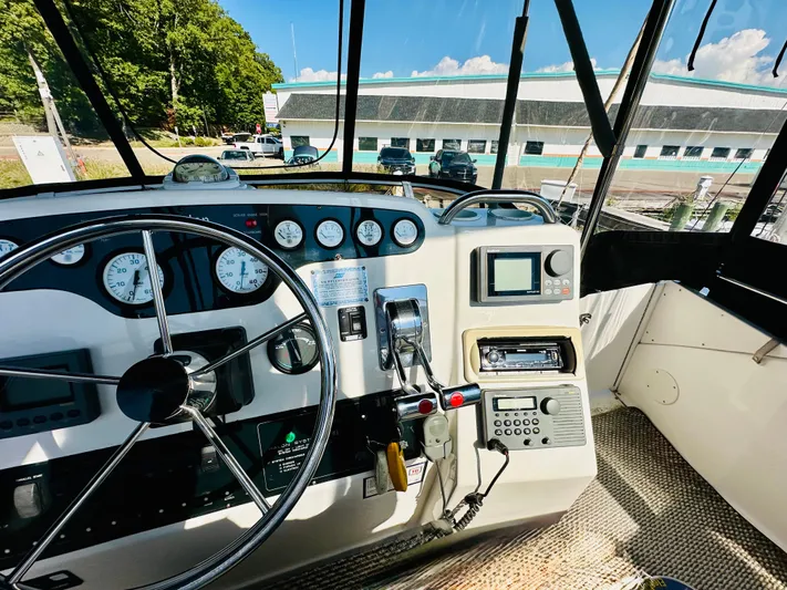 Precious Time Yacht Photos Pics Interior view of 1998 Silverton 392 Motor Yacht helm with steering wheel and navigation instruments.
