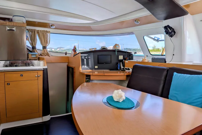 Imany Yacht Photos Pics Interior of 2012 Fountaine Pajot Lipari Owners Version catamaran, featuring modern kitchen and seating area.