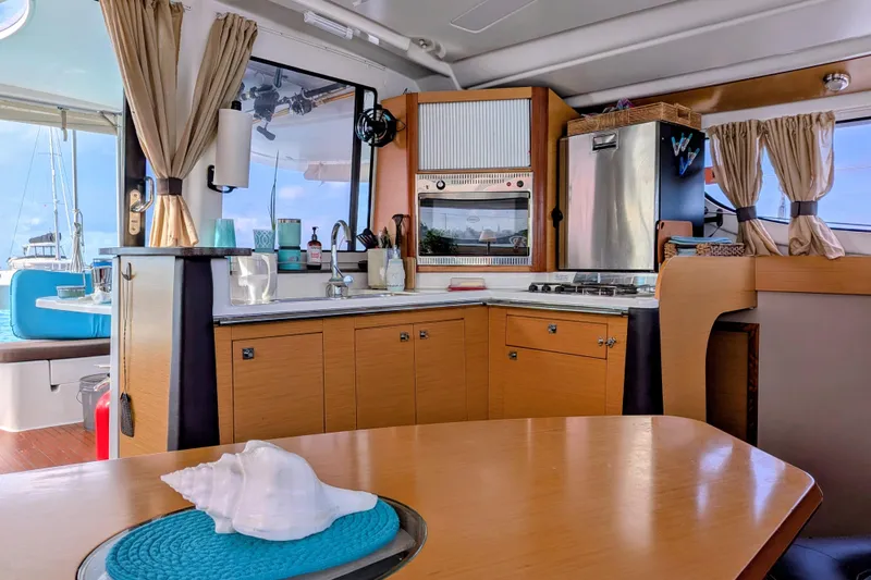Imany Yacht Photos Pics Interior of 2012 Fountaine Pajot Lipari Owners Version catamaran kitchen area.