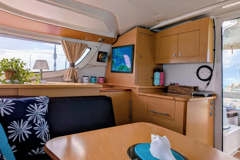 Imany Yacht Photos Pics Interior of 2012 Fountaine Pajot Lipari Owners Version catamaran, featuring cozy seating and nautical decor.