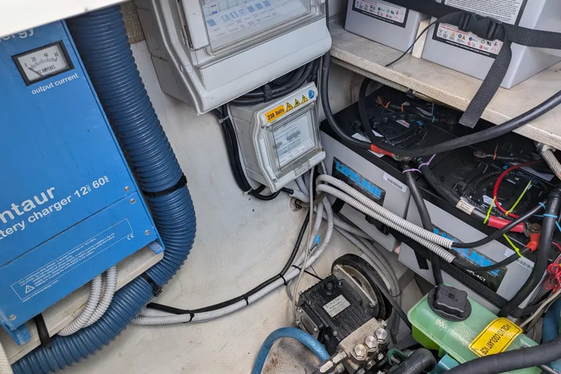 Imany Yacht Photos Pics Electrical system of a 2012 Fountaine Pajot Lipari catamaran, featuring battery charger and wiring.