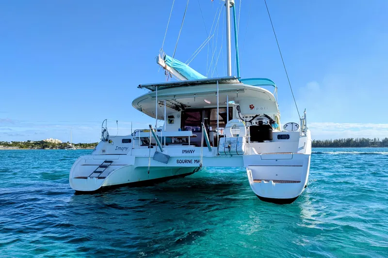 Imany Yacht Photos Pics 2012 Fountaine Pajot Lipari catamaran sailing on clear blue waters.