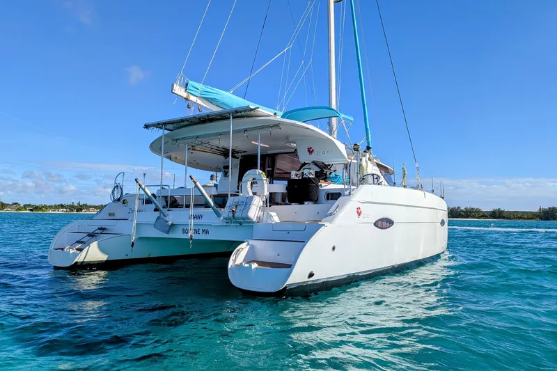 Imany Yacht Photos Pics 2012 Fountaine Pajot Lipari catamaran sailing on clear blue waters.