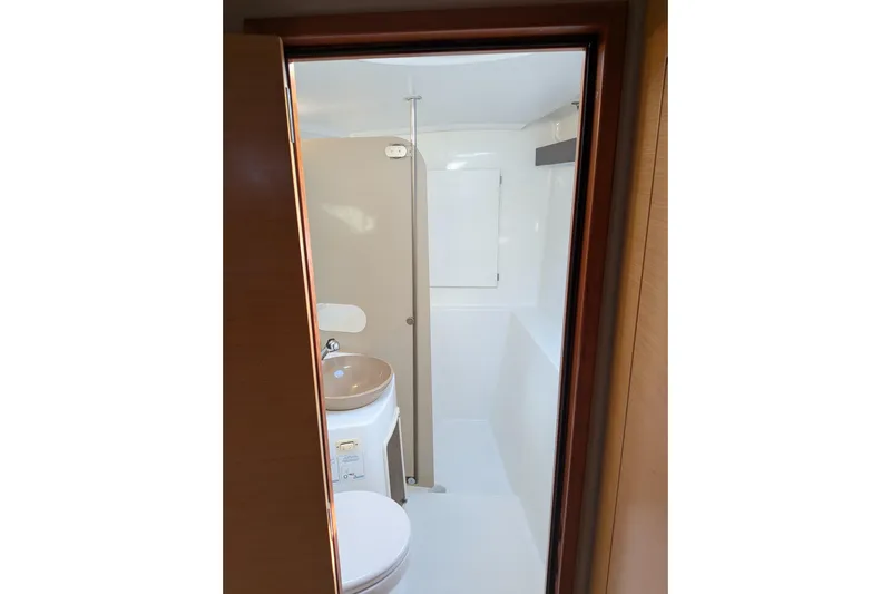 Imany Yacht Photos Pics Bathroom interior of 2012 Fountaine Pajot Lipari catamaran, featuring sink and shower.