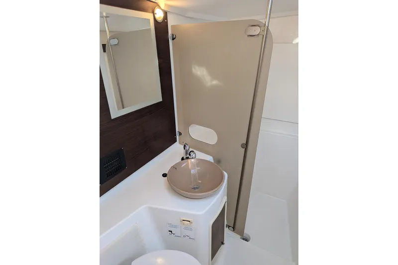 Imany Yacht Photos Pics Modern bathroom in 2012 Fountaine Pajot Lipari catamaran with sleek sink and mirror.