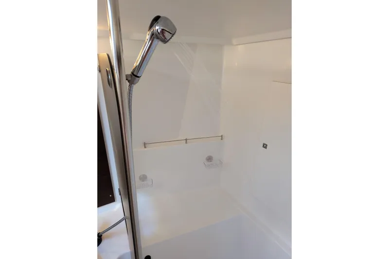 Imany Yacht Photos Pics Shower area in 2012 Fountaine Pajot Lipari catamaran, featuring a handheld showerhead.