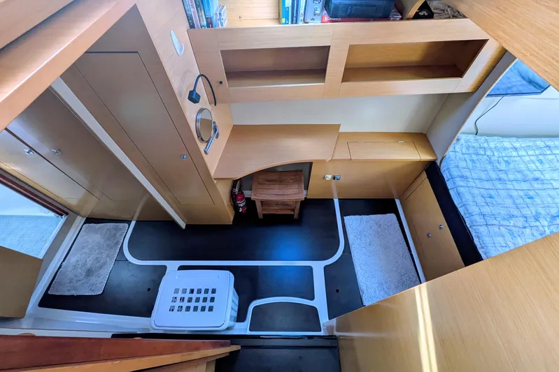 Imany Yacht Photos Pics Interior of 2012 Fountaine Pajot Lipari catamaran, featuring cozy cabin with wooden furnishings.