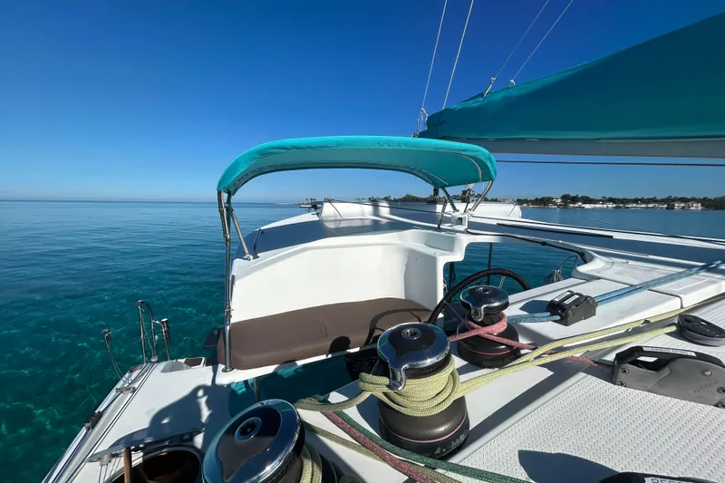 Imany Yacht Photos Pics 2012 Fountaine Pajot Lipari catamaran sailing on clear blue waters under a sunny sky.