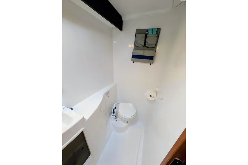 Imany Yacht Photos Pics Compact bathroom in 2012 Fountaine Pajot Lipari catamaran, featuring toilet and storage.