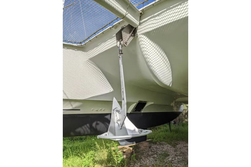 Imany Yacht Photos Pics 2012 Fountaine Pajot Lipari catamaran anchor detail with netting and hull visible.