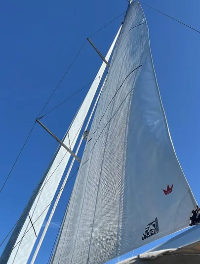  Yacht Photos Pics Sailing yacht Beneteau Sense 55, 2013 model, with sails unfurled against a clear blue sky.