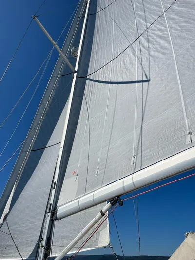  Yacht Photos Pics Sailing yacht Beneteau Sense 55, 2013 model, with sails unfurled against a clear blue sky.