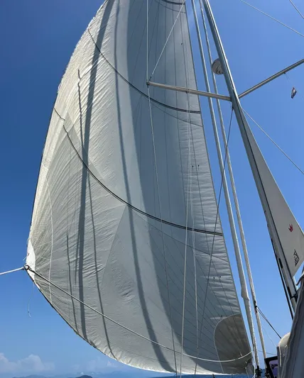  Yacht Photos Pics Sailing yacht Beneteau Sense 55, 2013 model, with full sails against a clear blue sky.