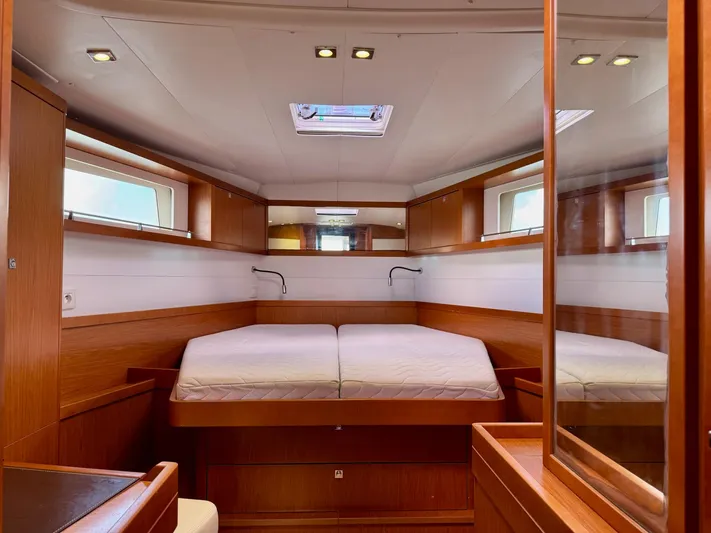  Yacht Photos Pics Luxurious cabin interior of 2013 Beneteau Sense 55 yacht with wooden finishes.