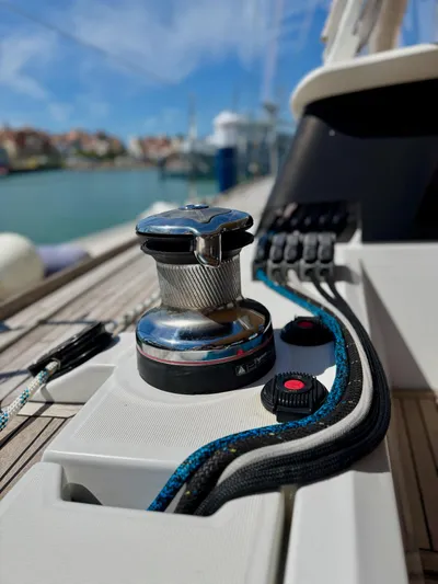  Yacht Photos Pics Close-up of a 2013 Beneteau Sense 55 sailboat winch and control panel on deck.