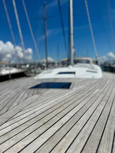  Yacht Photos Pics 2013 Beneteau Sense 55 sailboat deck with clear blue sky background.