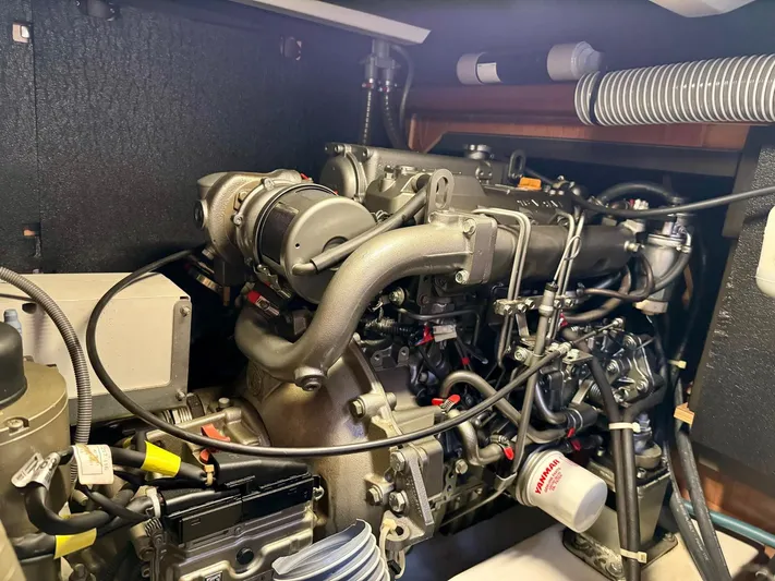  Yacht Photos Pics Engine compartment of a 2013 Beneteau Sense 55 yacht, showcasing detailed mechanical components.