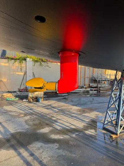  Yacht Photos Pics Underwater view of 2013 Beneteau Sense 55 sailboat with red and yellow propeller.