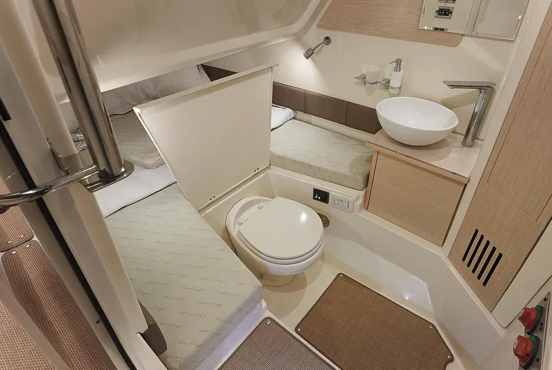  Yacht Photos Pics Manufacturer Provided Image: 2020 Chris-Craft Catalina 30 bathroom with toilet, sink, and sleeping area.