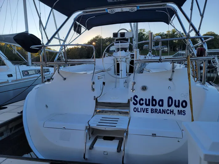 Scuba Duo Yacht Photos Pics 2004 Hunter 41 AC sailboat named "Scuba Duo" docked at a marina.