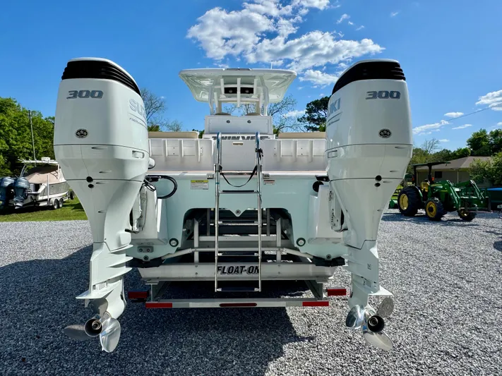  Yacht Photos Pics 2023 Twin Vee 280 GFX CC boat with dual 300 horsepower engines, rear view.