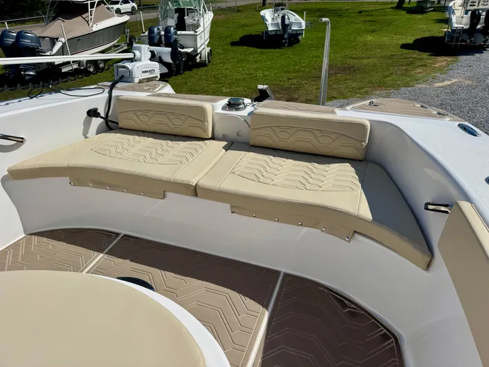  Yacht Photos Pics 2023 Twin Vee 280 GFX CC boat with beige cushioned seating and deck.