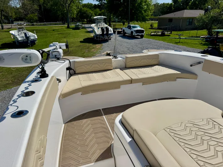  Yacht Photos Pics 2023 Twin Vee 280 GFX CC boat with beige seating and modern design.