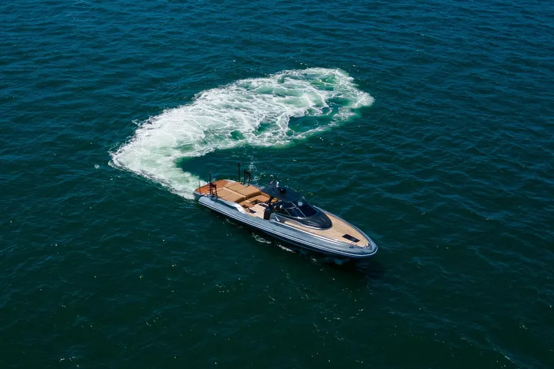 Quikwood Yacht Photos Pics 2014 SACS Strider yacht cruising on open blue sea, leaving a swirling wake.