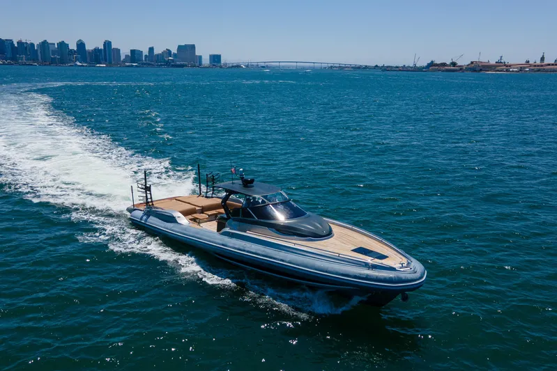 Quikwood Yacht Photos Pics 2014 SACS Strider yacht cruising near city skyline and bridge.