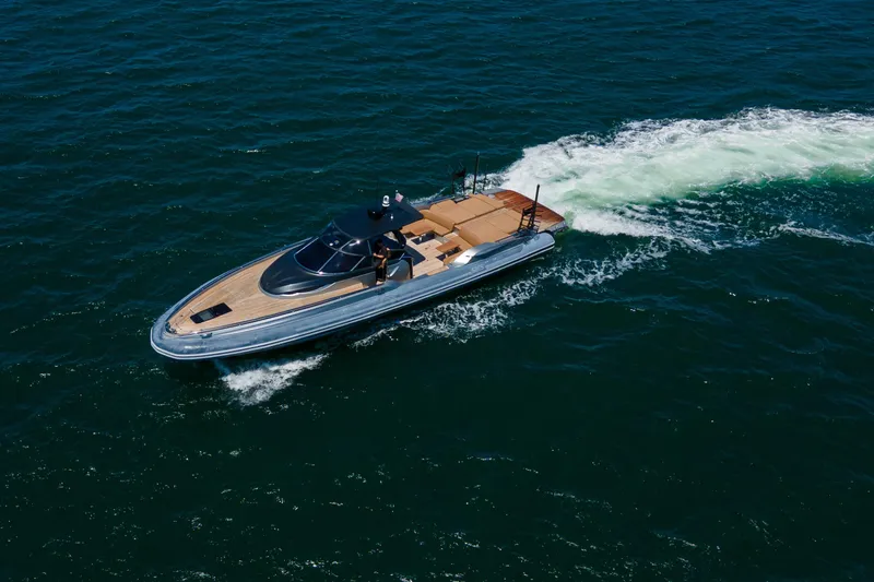 Quikwood Yacht Photos Pics 2014 SACS Strider yacht cruising on open water, showcasing sleek design and luxury features.