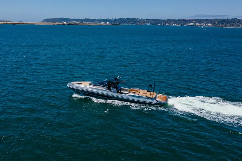 Quikwood Yacht Photos Pics 2014 SACS Strider yacht cruising on open blue water near coastline.