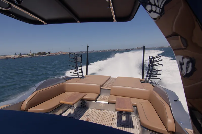 Quikwood Yacht Photos Pics 2014 SACS Strider boat cruising on open water with comfortable seating.