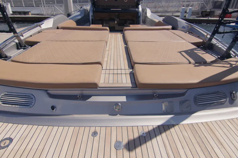 Quikwood Yacht Photos Pics 2014 SACS Strider boat with spacious sunbathing deck and cushioned seating.